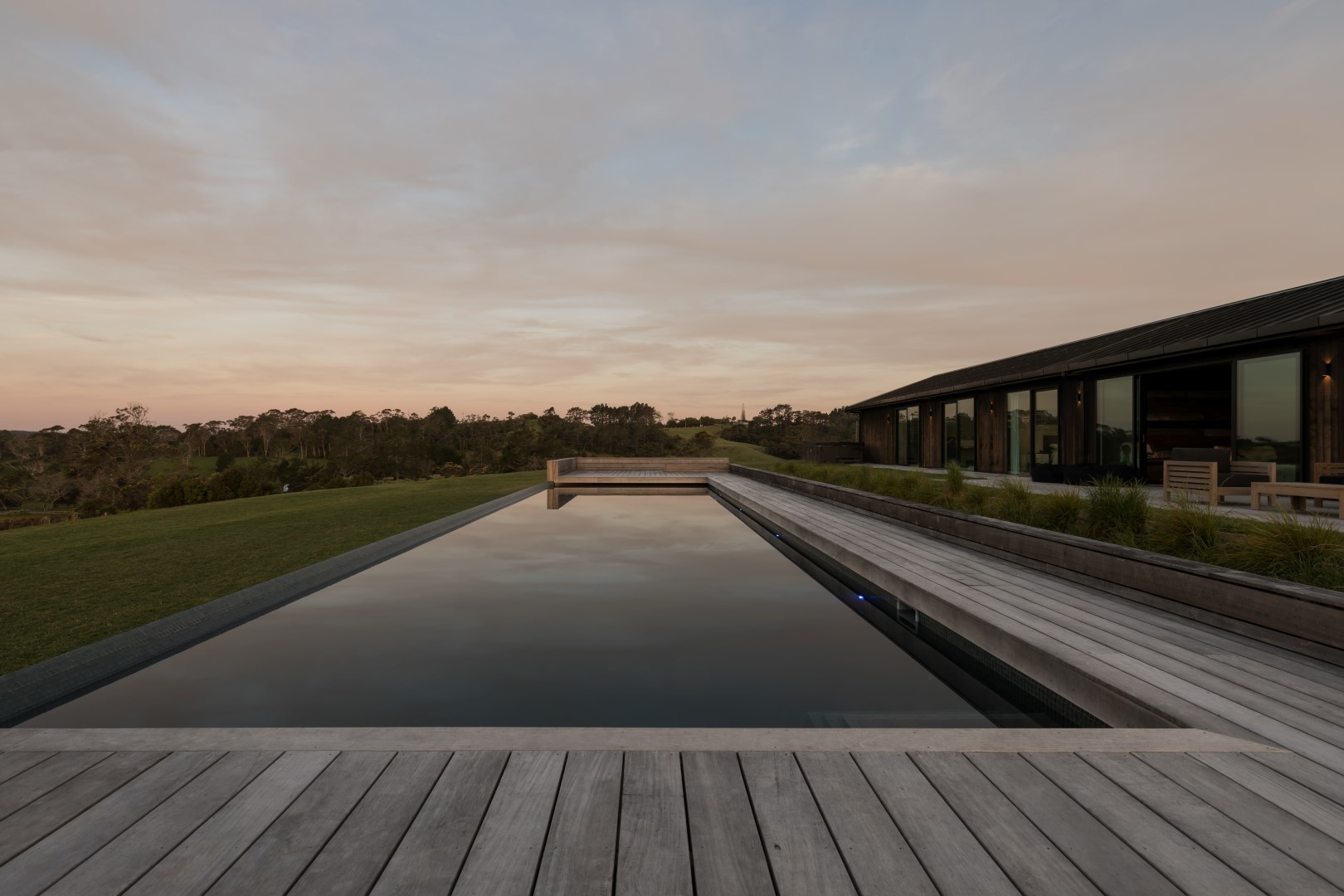 kumeu-residence-arcline-architecture-pool-evening-water-deck-living-outdoor