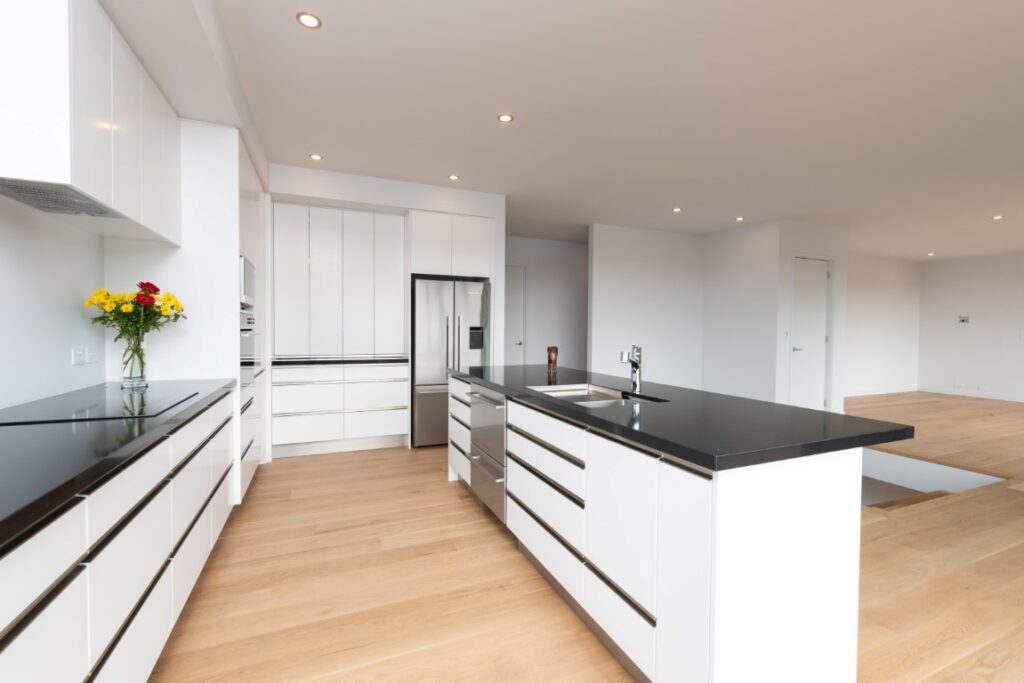 forest-heights-home-kerikeri-architect-arcline-architecture-kitchen-white-black-timber-floor