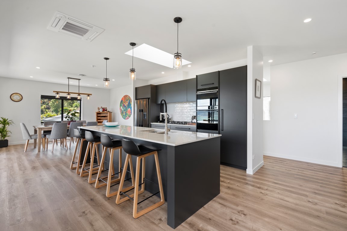 russell-house-kitchen-design-black-white-island-dark-appliances-wood-flooring-bach-arcline-architecture