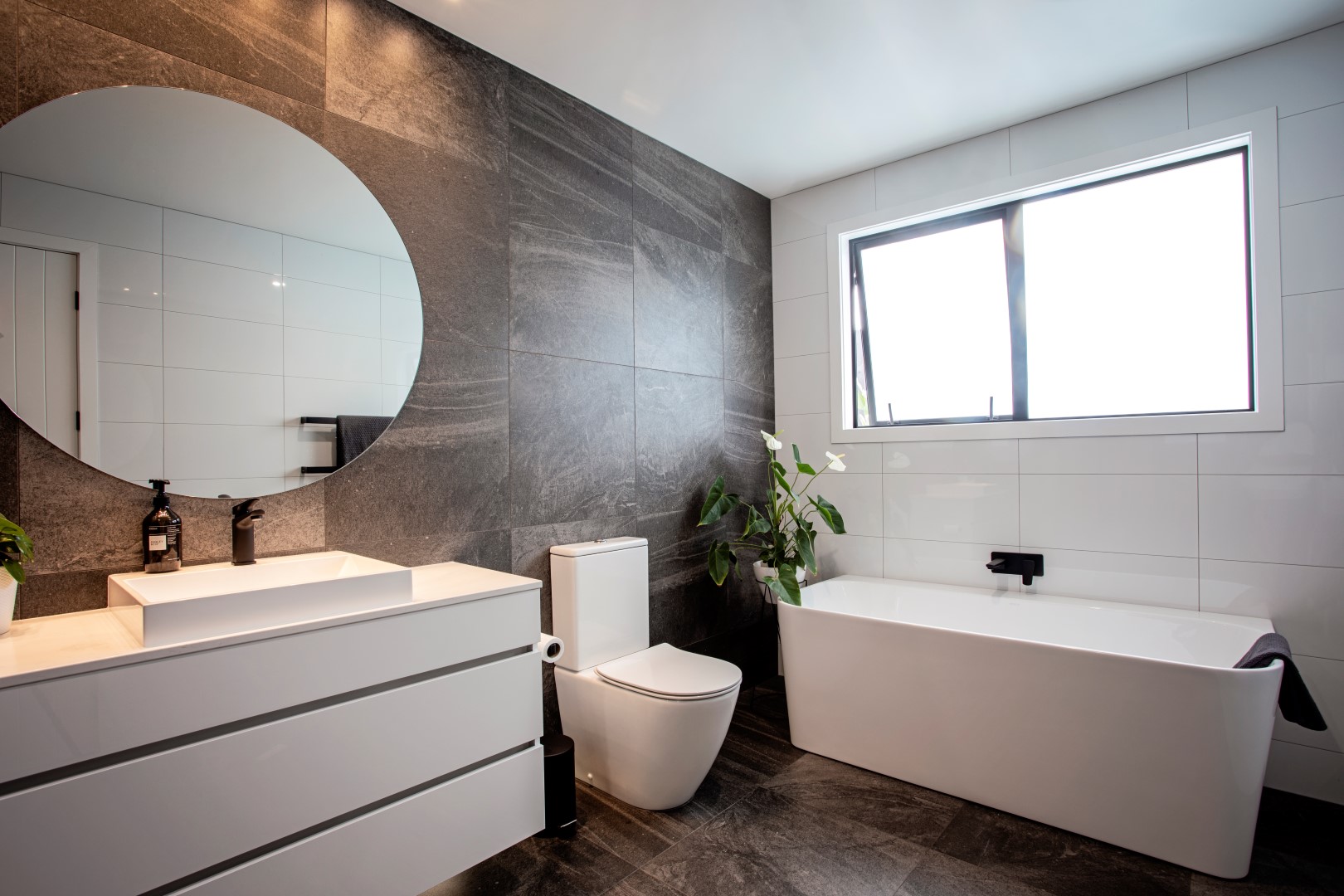 bathroom-layout-design-bath-vanity-grey-tiles-white-toilet-mirror-arcline-architecture