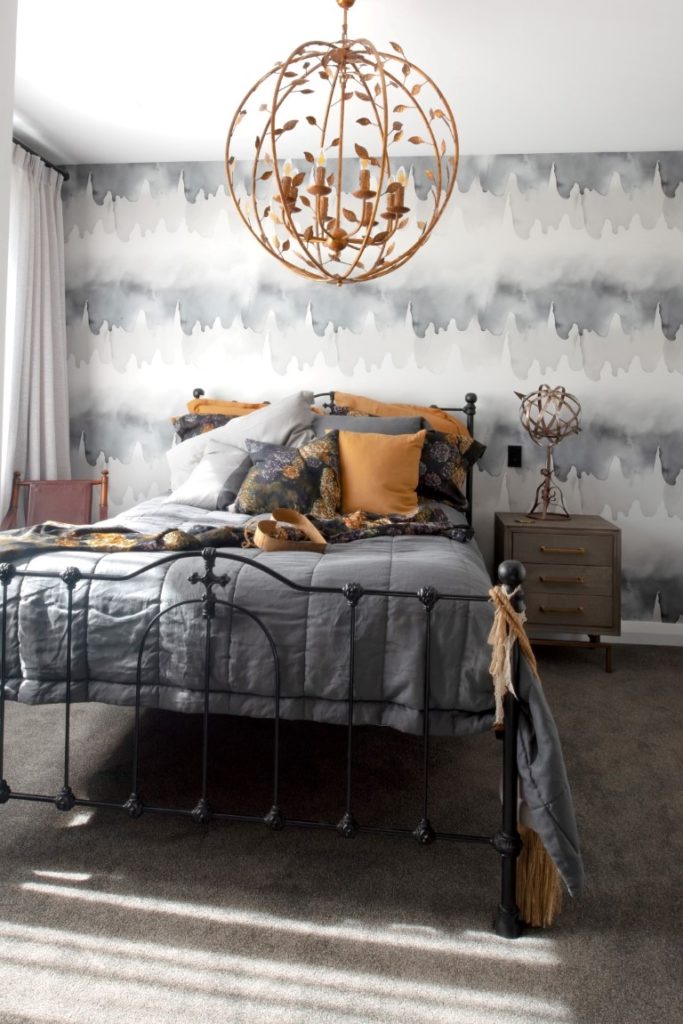 bedroom-interior-design-grey-bedspread-wallpaper-goldlight-black-bed-end-drapes-arcline-architecture
