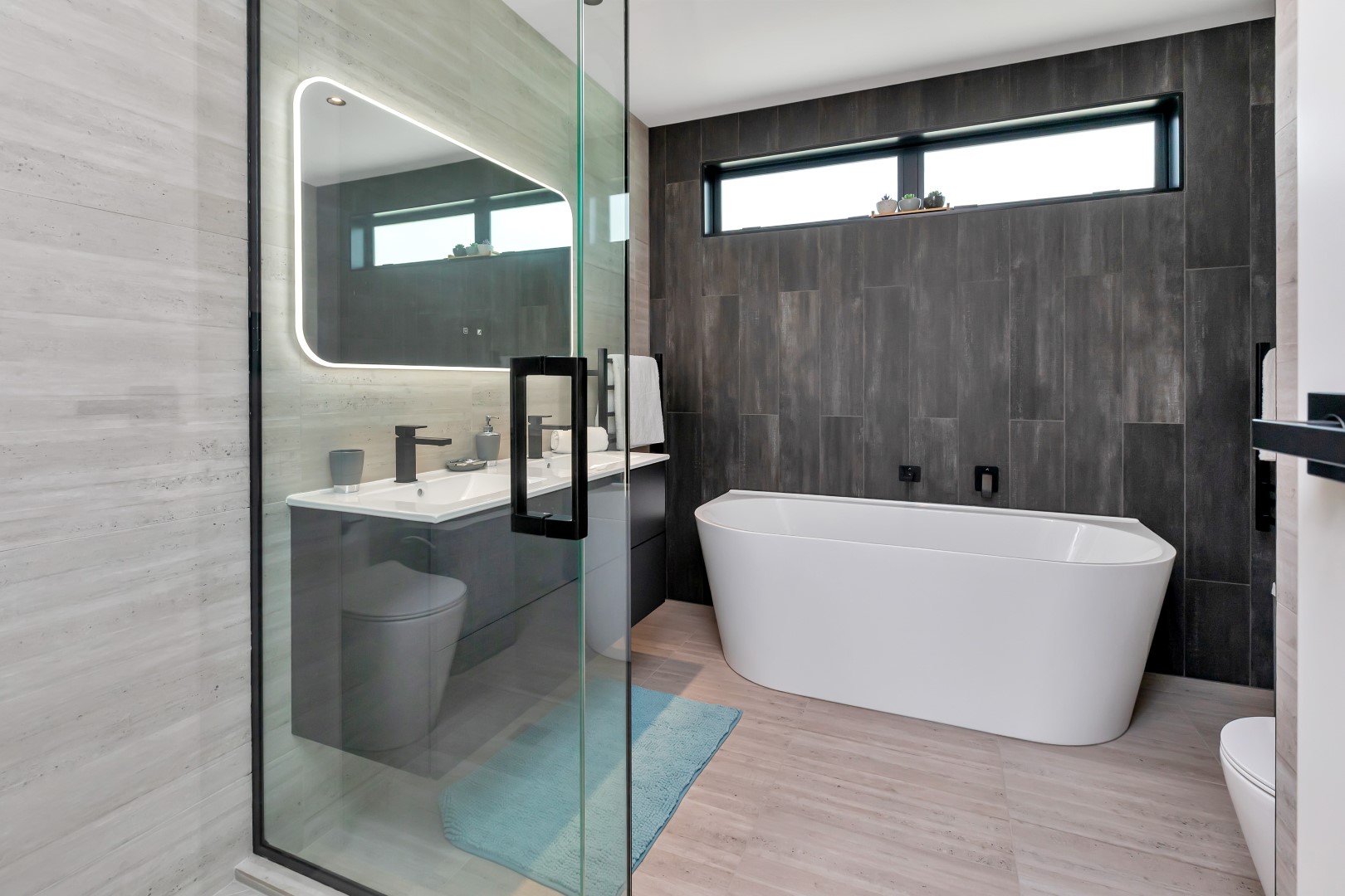 black-neutral-bathroom-glass-shower-white-bath-arcline-architecture