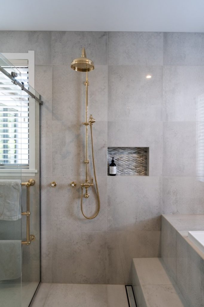 gold-shower-slide-rose-step-bath-drain-soap-recess-sliding-glass-door-arcline-architecture-rainhead