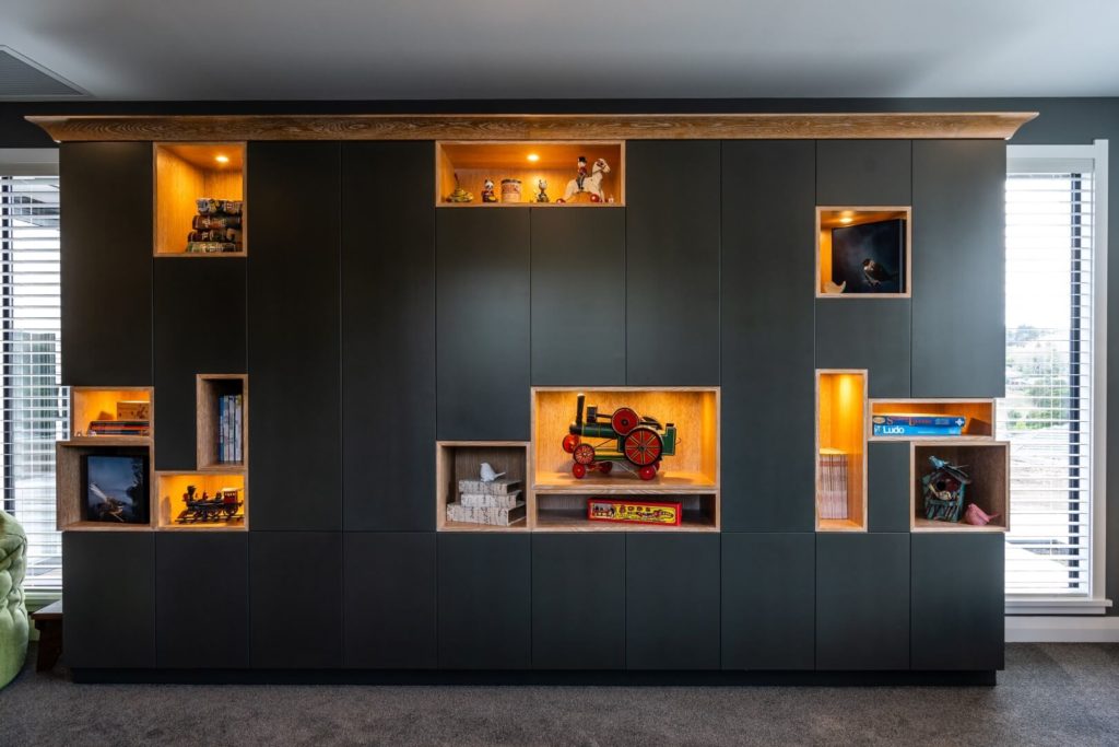 toy-cupboards-feature-cabinetry-wood-design-carpet-arcline-architecture
