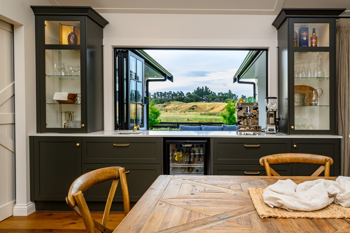 bar-window-open-bi-fold-fridge-raking-ceiling-arcline-architecture-dining