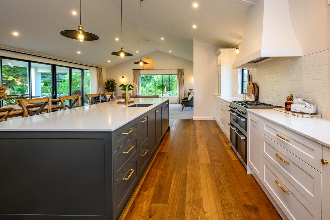 white-modern-kitchen-design-arcline-architecture-timber-floor-raking-ceiling-appliances