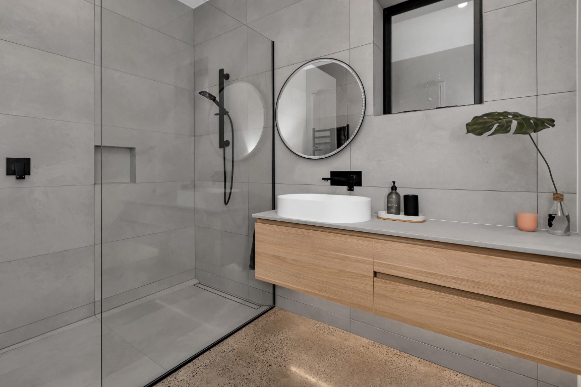bathroom-design-grey-tiles-timber-vanity-white-bowl-white-bath-ladder-towel-rail-arcline-architecture (1)