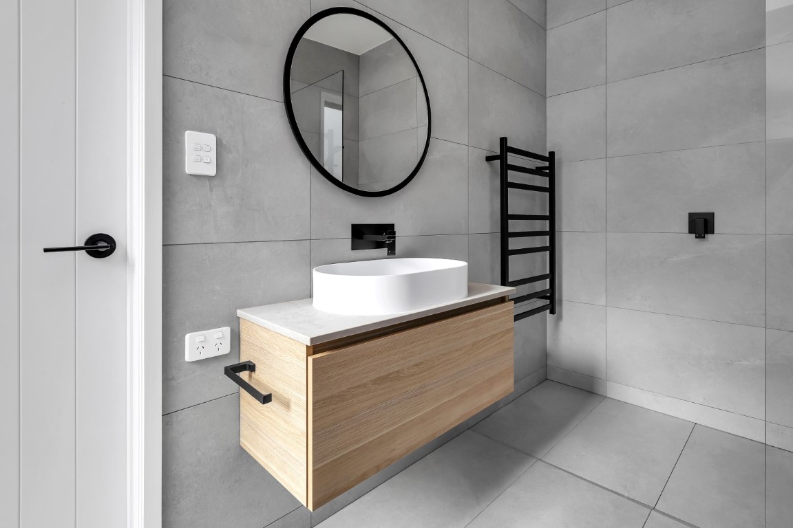 bathroom-design-grey-tiles-timber-vanity-white-bowl-white-bath-ladder-towel-rail-arcline-architecture (2)