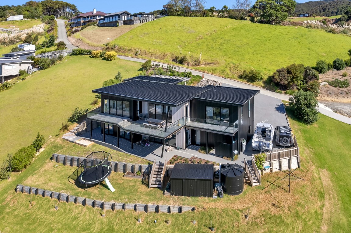 drone-photography-arcline-architecture-black-house-roof-cladding-retaining-walls-decking