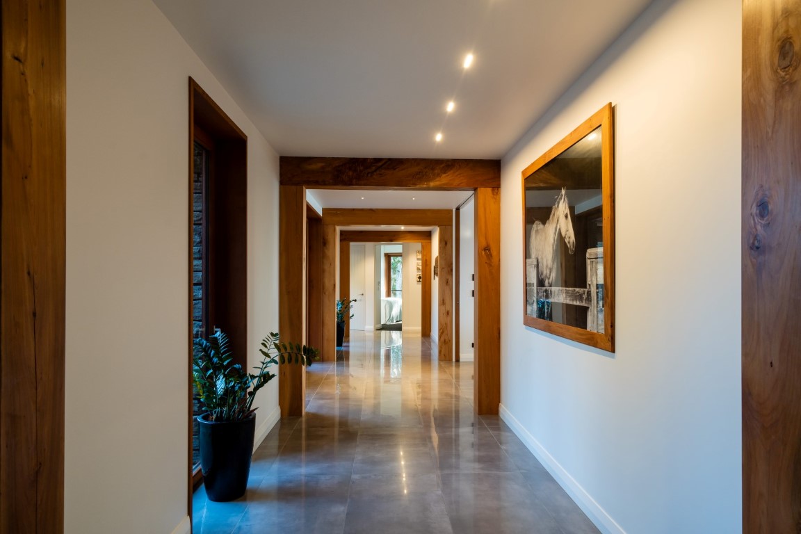 hallway-timber-beams-concrete-tile-floor-arcline-architecture