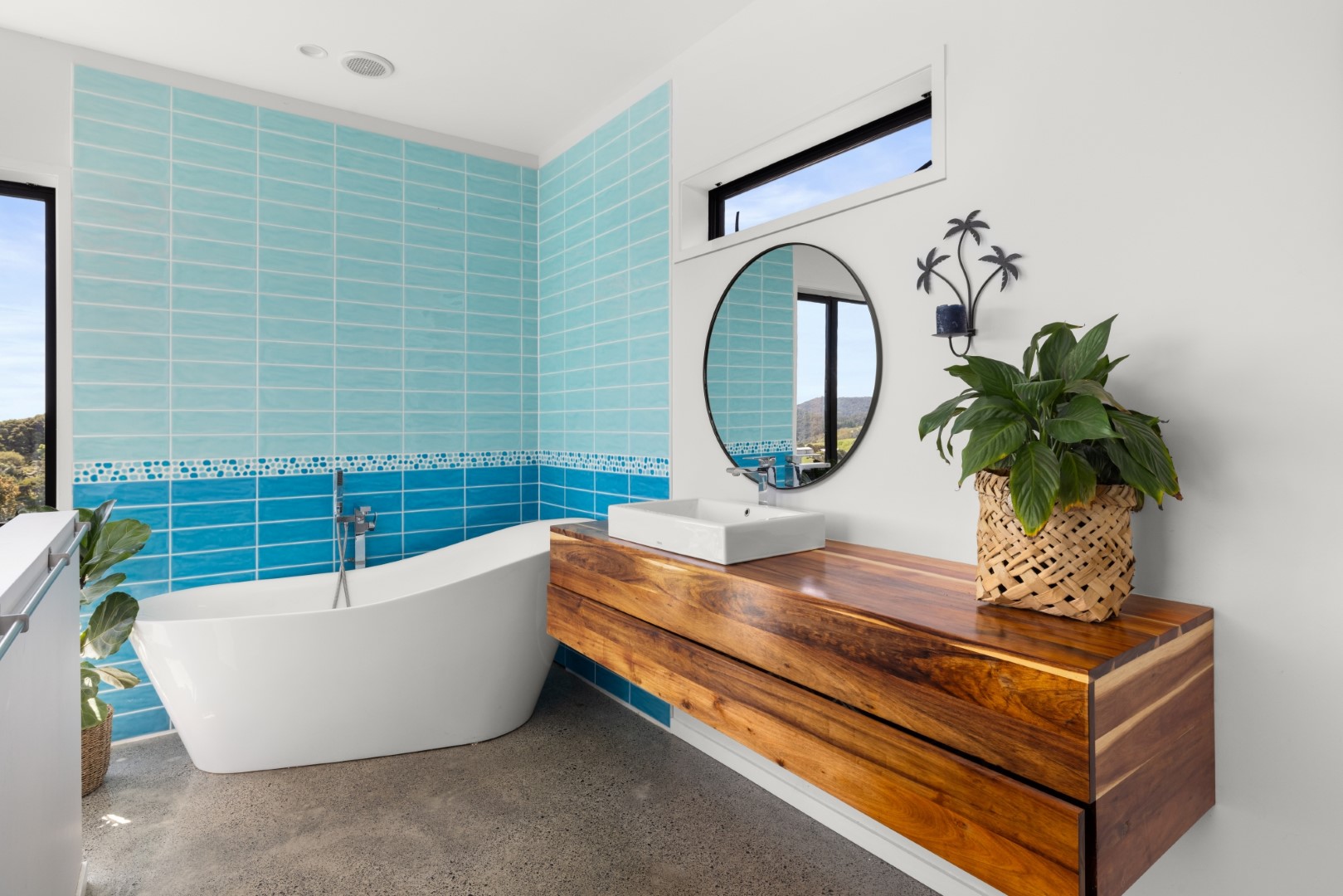 white-bathroom-wood-vanity-shower-layout-blue-tiles-arcline-architecture