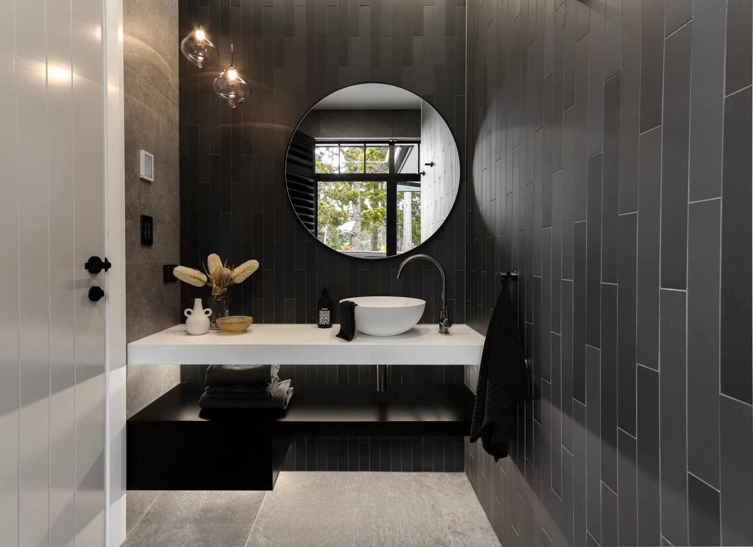 floating-bench-white-bathroom-fixtures-contrasting-taps-light-mirror-arcline-architecture