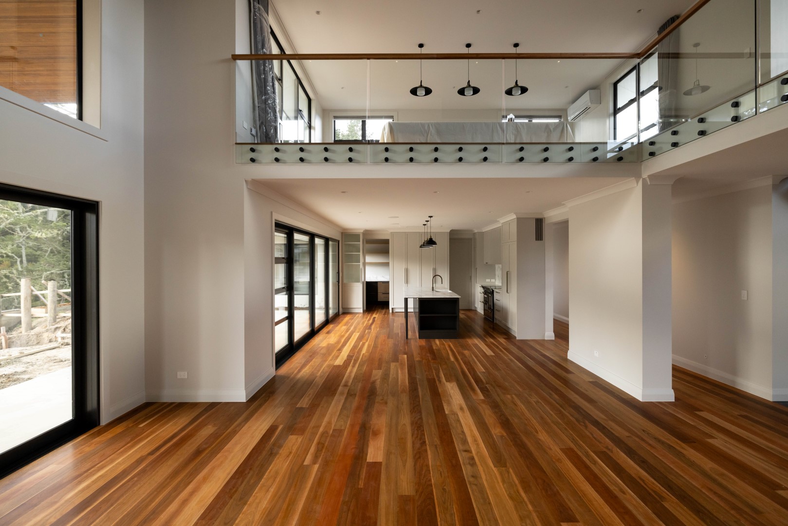 grand-living-room-space-void-two-storey-timber-floors-arcline-architecture