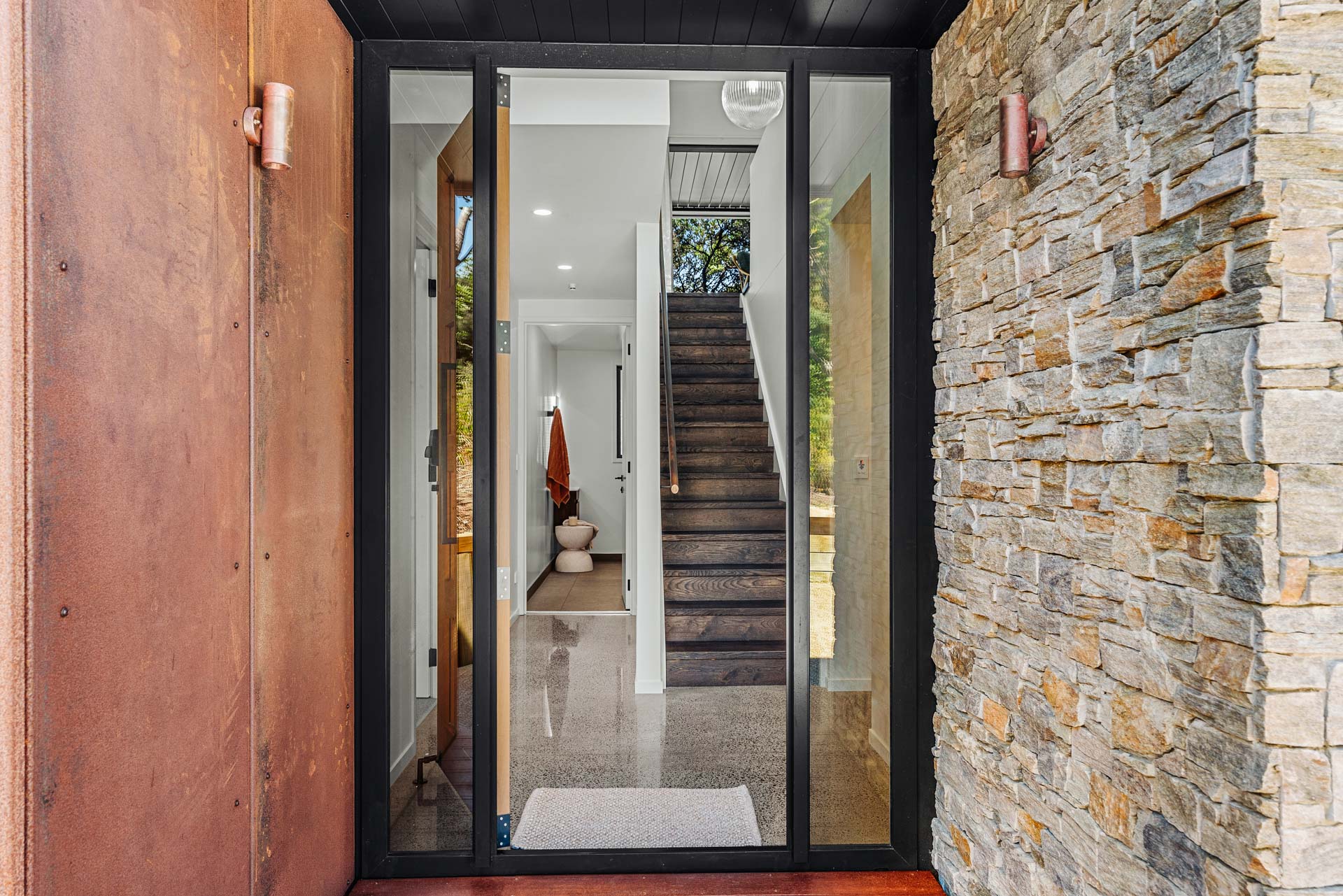 home-entry-door-craftstone-veneer-corten-steel-rainscreen-arcline-architecture