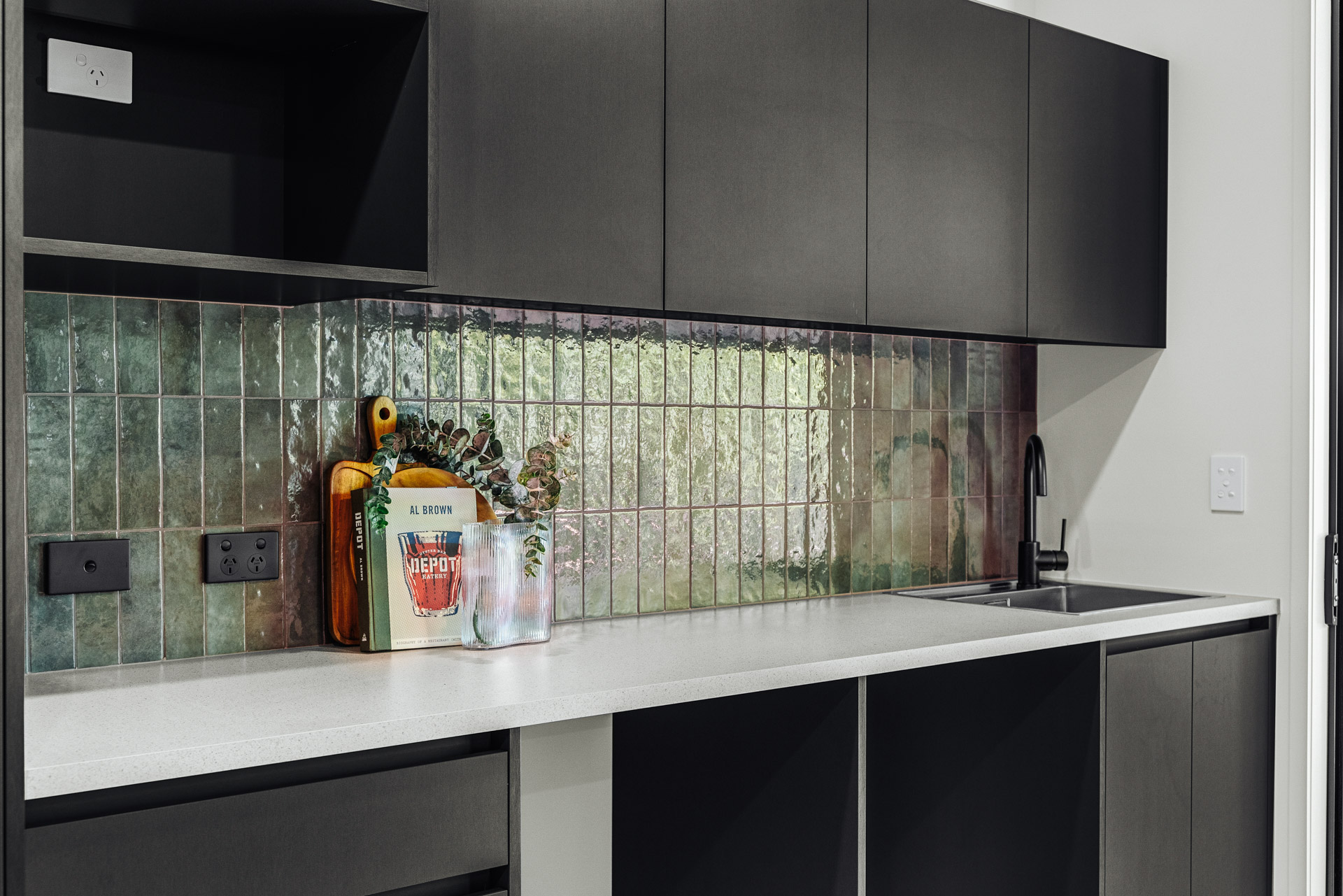 laundry-design-green-tiles-splashback-black-cabinetry-arcline-architecture
