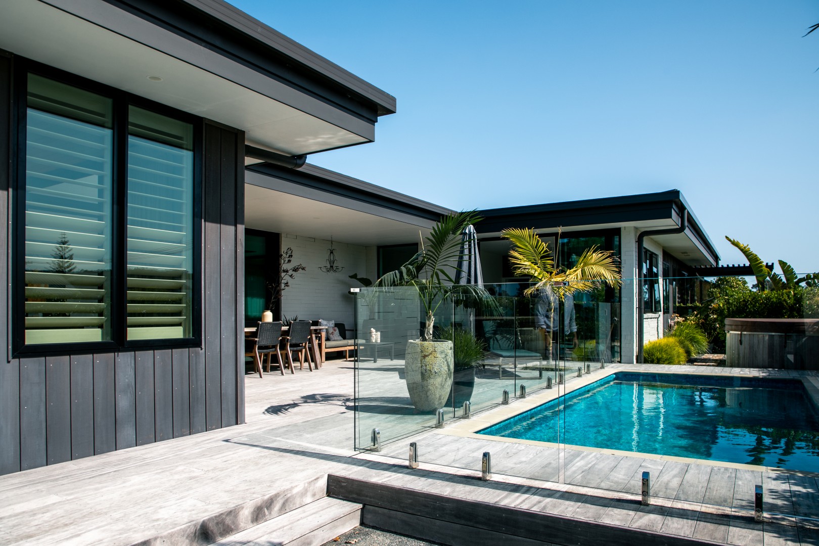 decking-with-blue-pool-outdoor-living-arcline-architecture-nz-design-palm-springs