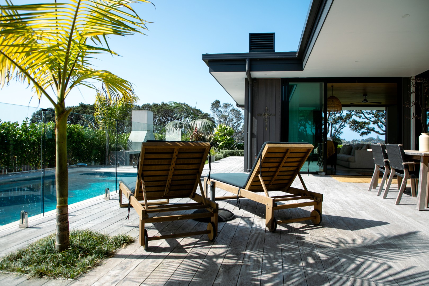 decking-with-blue-pool-outdoor-living-arcline-architecture-nz-design-palm-springs
