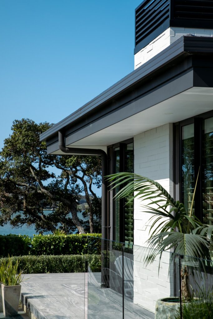 waterfront-cedar-chimney-white-painted-brick-cladding-decking-arcline-architecture