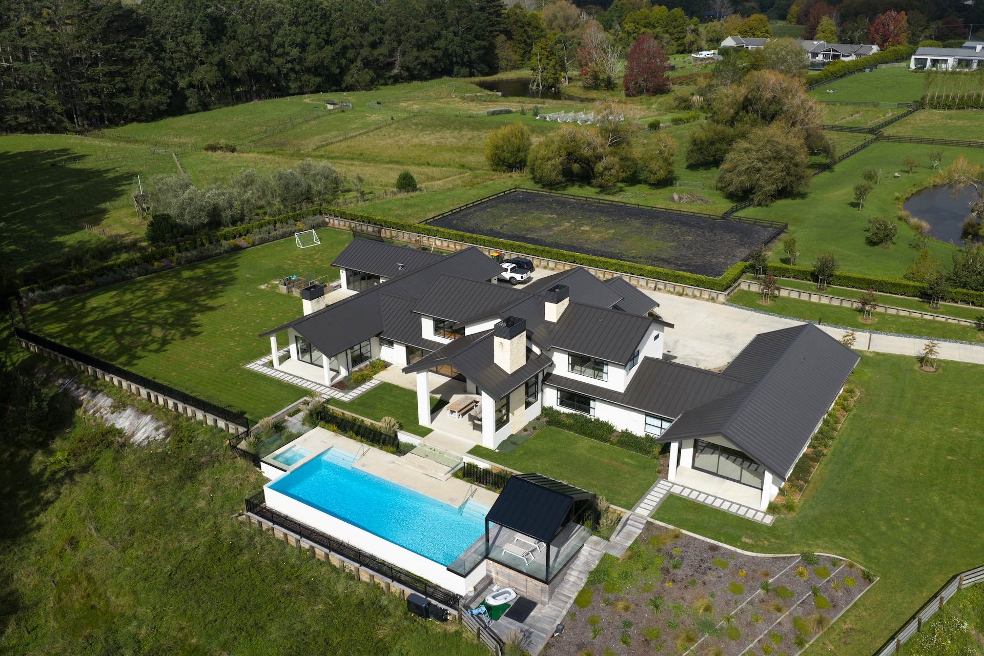 arcline-architecture-aerial-view-of-rural-estate-with-pool-and-surrounding-farmland