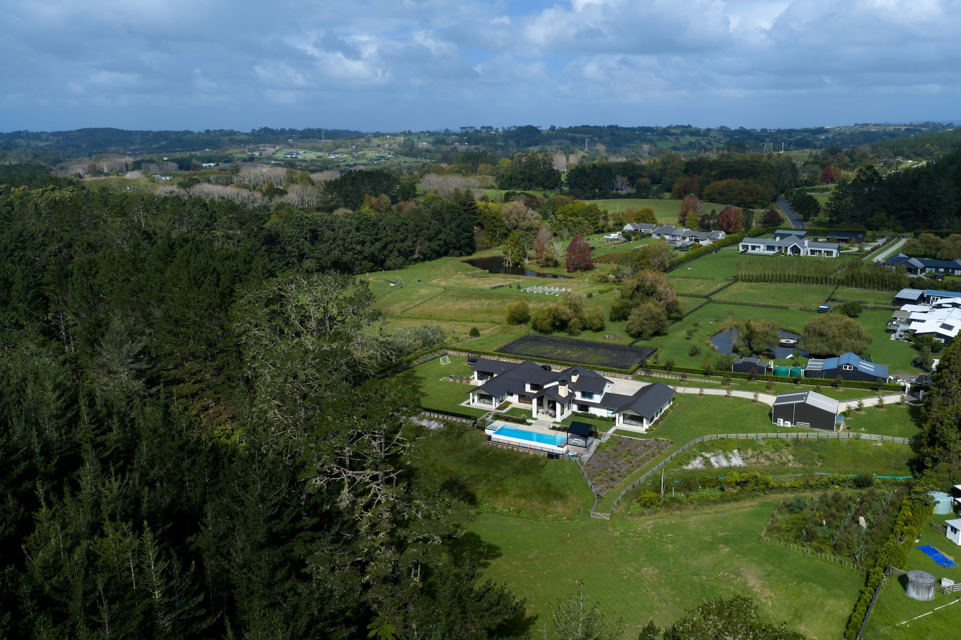 arcline-architecture-wide-aerial-of-rural-northland-setting-with-home-and-pool-in-landscape
