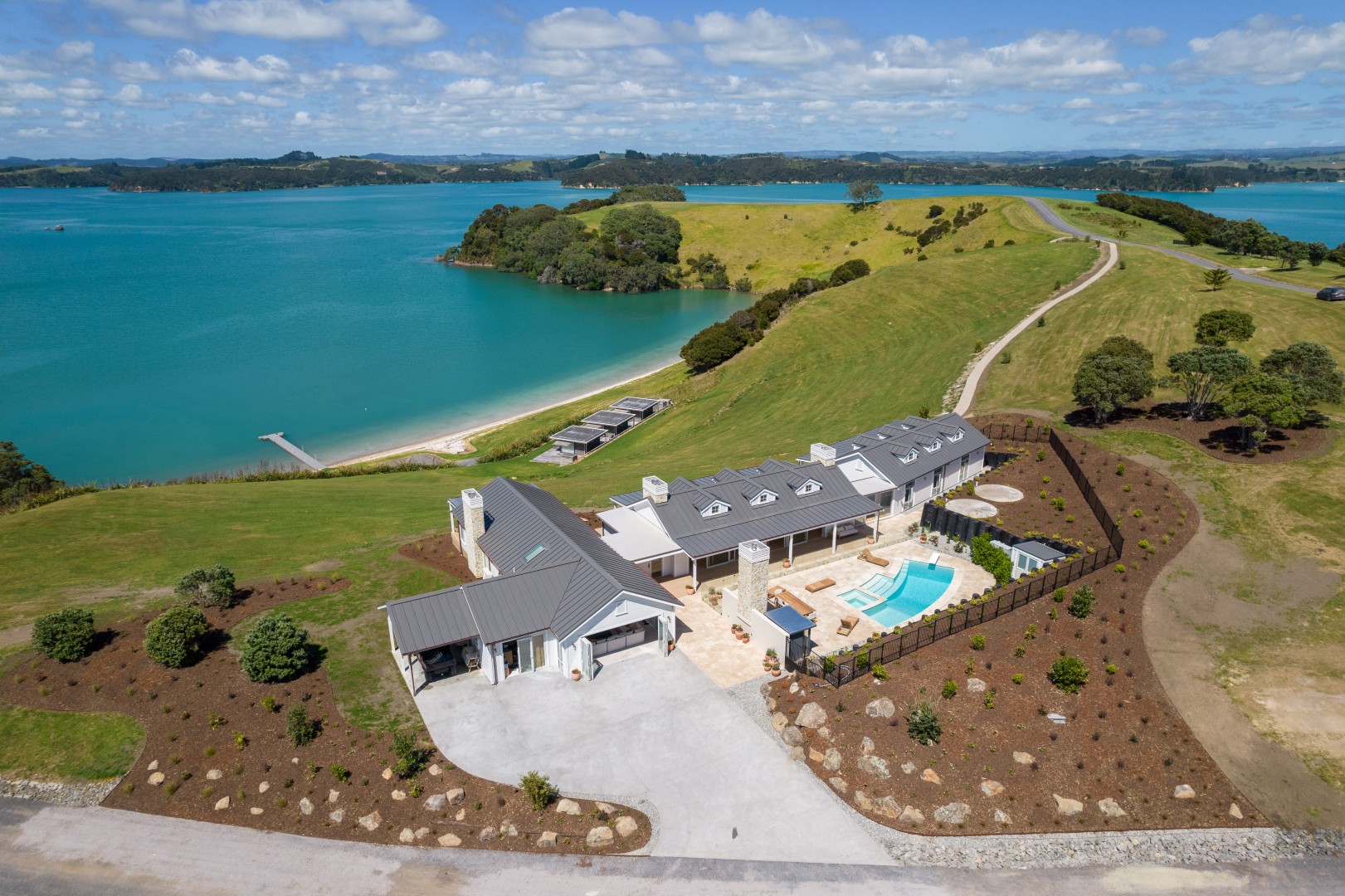 arcline-architecture-wiroa-station-residence-aerial-coastal-headland-beach-jetty-pool
