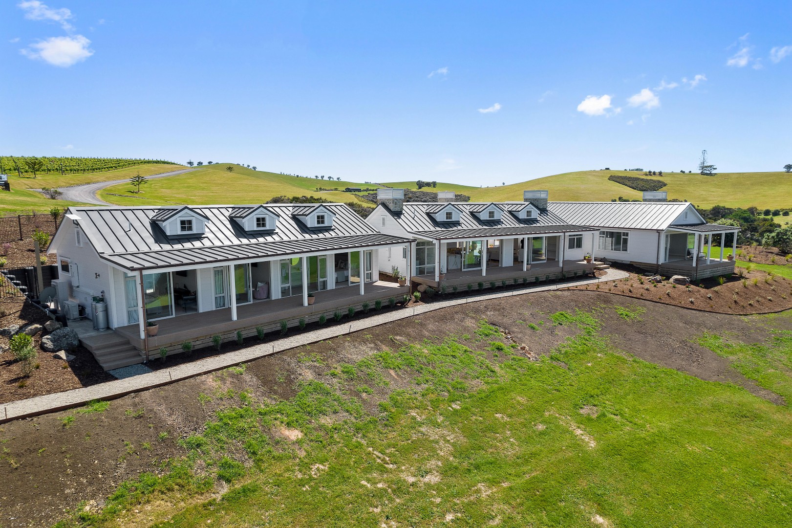 arcline-architecture-wiroa-station-residence-front-elevation-verandas-dormers-linea-cladding