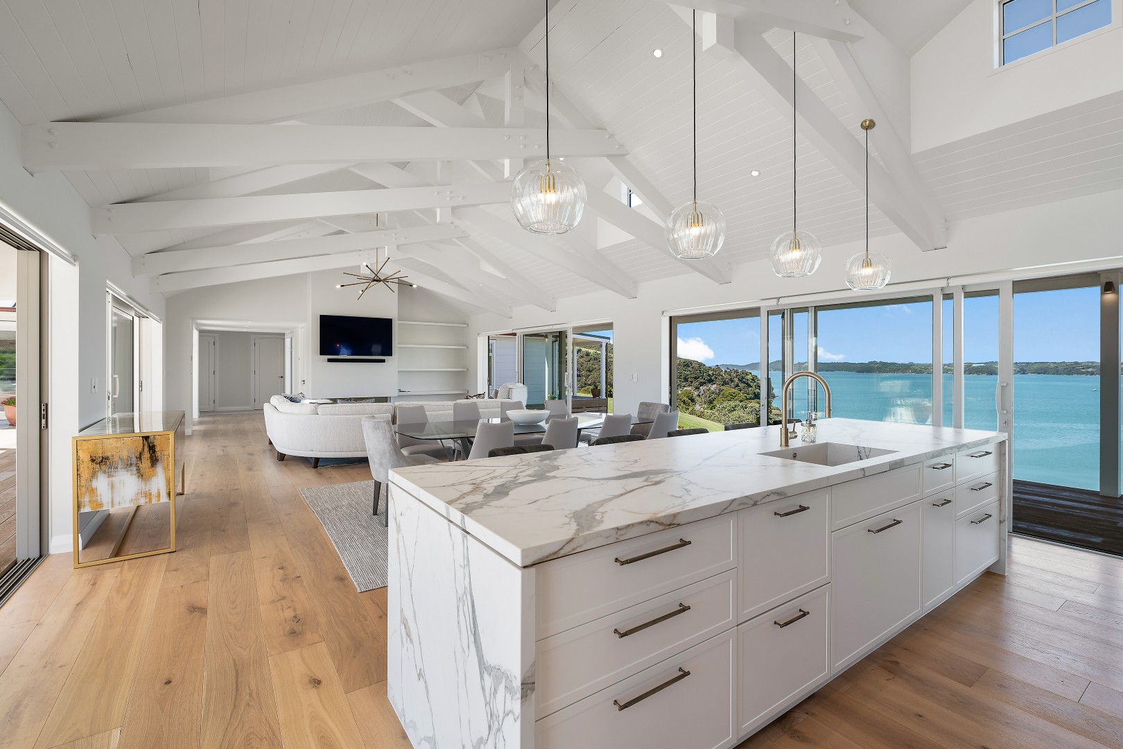 arcline-architecture-wiroa-station-residence-kitchen-island-marble-benchtop-open-plan-inlet-view