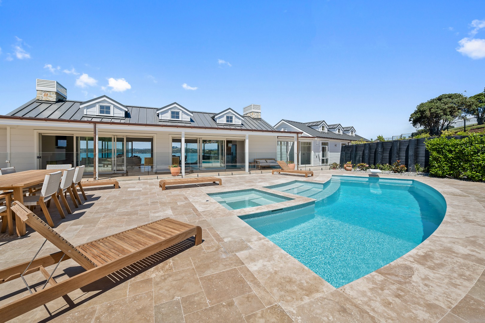 arcline-architecture-wiroa-station-residence-pool-spa-travertine-paving-dormers-stone-chimney