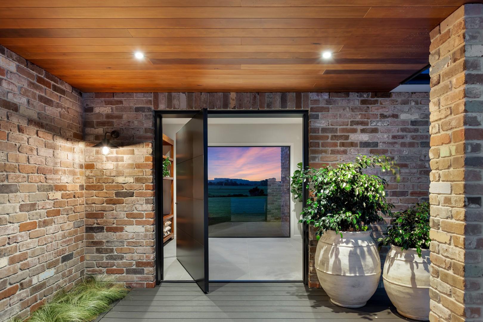 reclaimed-brick-entry-with-pivot-front-door-arcline-architecture-picture-window