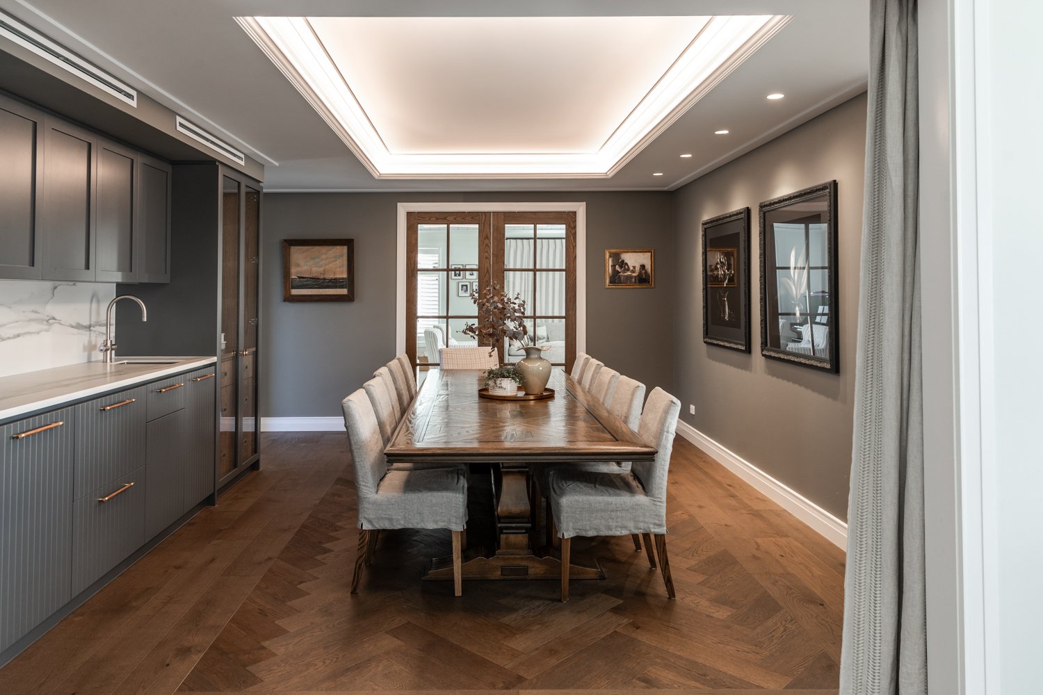 dining-room-with-herringbone-floor-tray-ceiling-and-open-kitchen-arcline-architecture