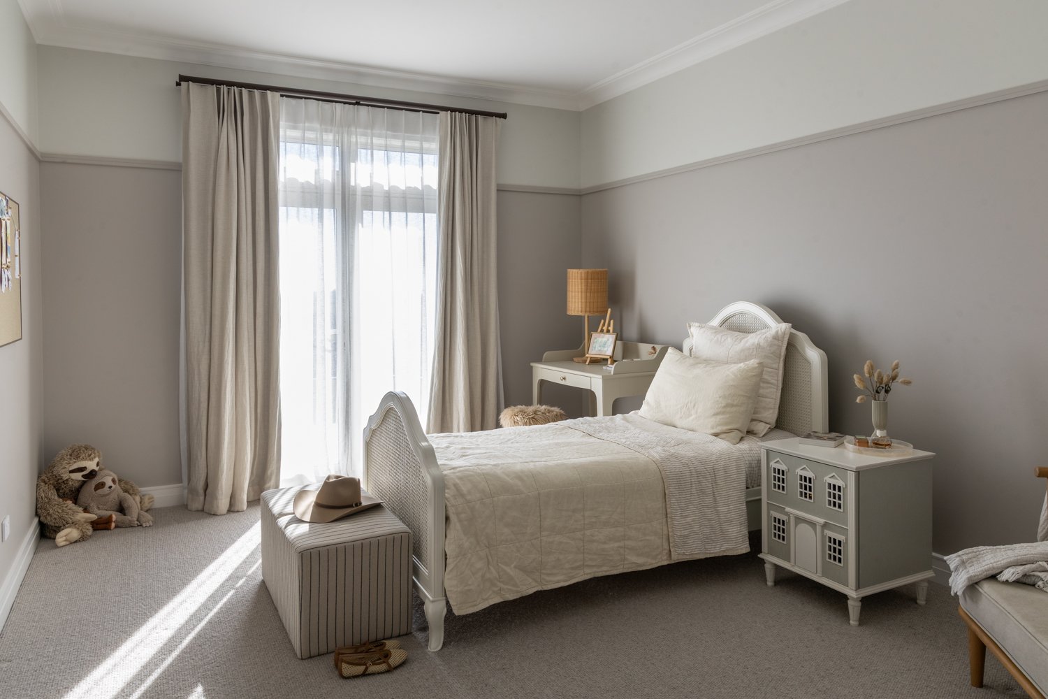 kids-bedroom-with-cane-bed-frame-and-dollhouse-nightstand-arcline-architecture