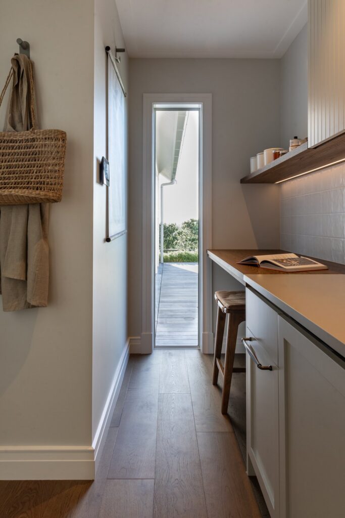 scullery-study-nook-with-desk-and-door-to-deck-arcline-architecture